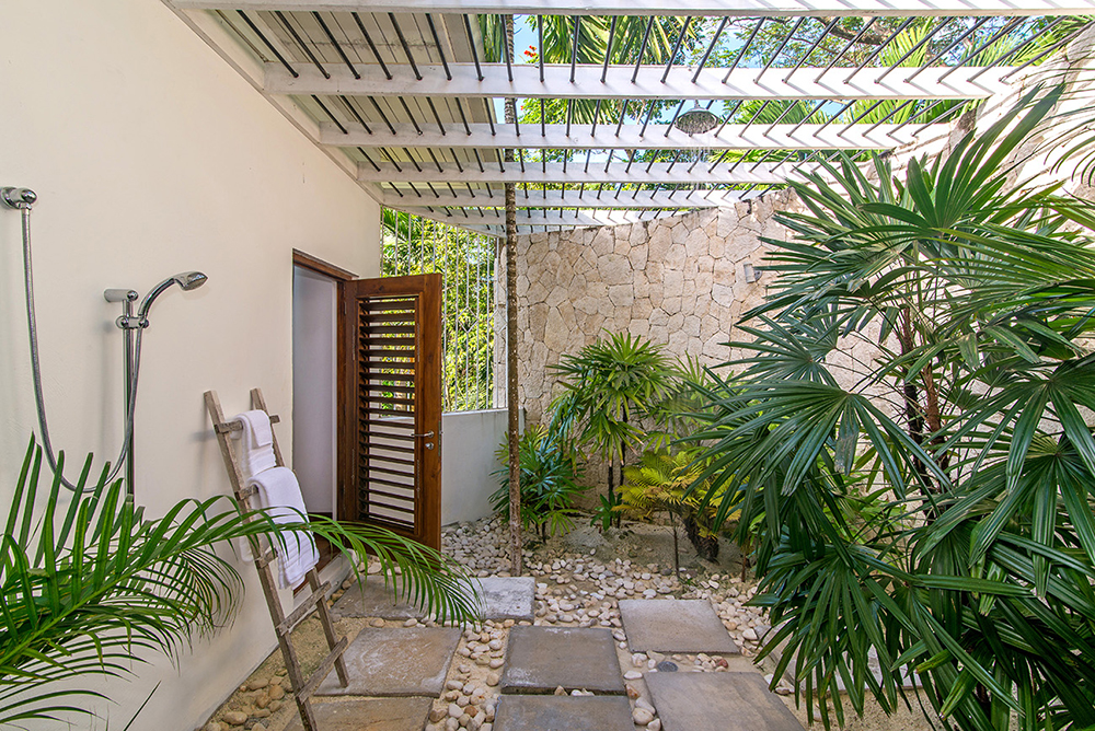 ... and large connecting outdoor shower in a walled palm garden. More than one companion by invitation only!