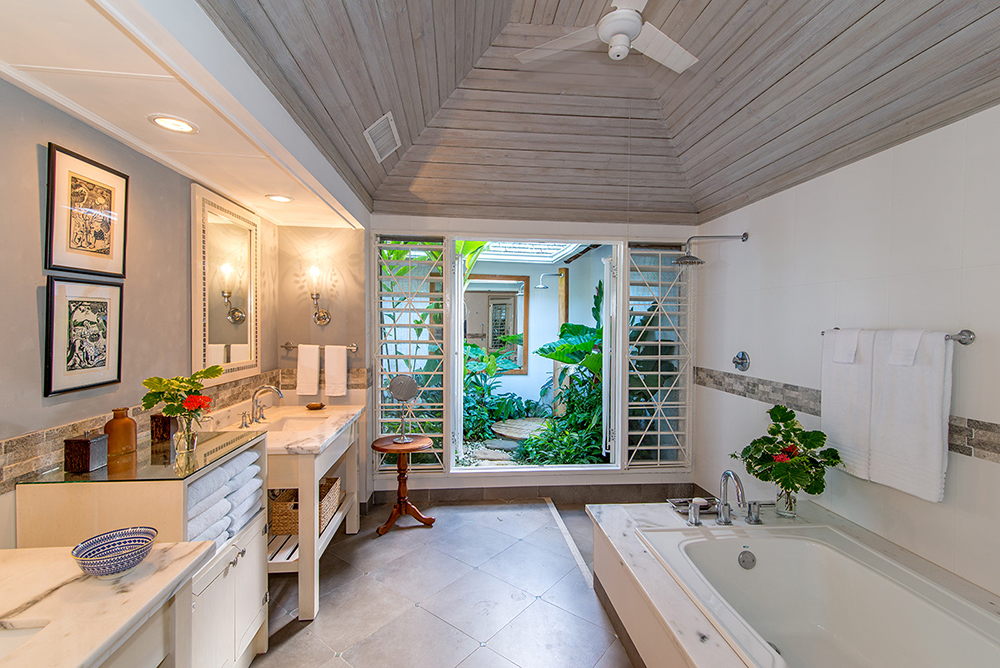 en-suite bathroom with soaking tub, rain shower and outdoor shower
