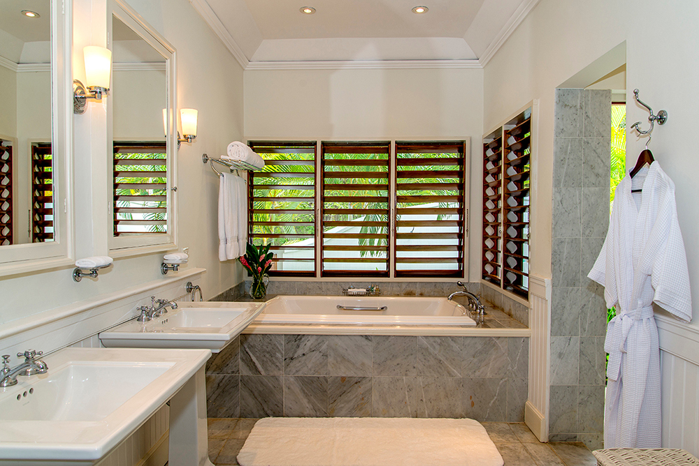 All five bedrooms feature glamorous en-suite bathrooms, each with indoor and (everyone's favorite) outdoor showers.