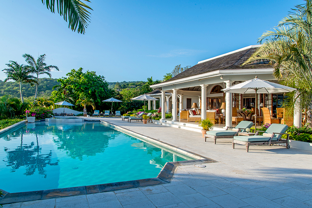 The heated pool spans the entire front of the villa.