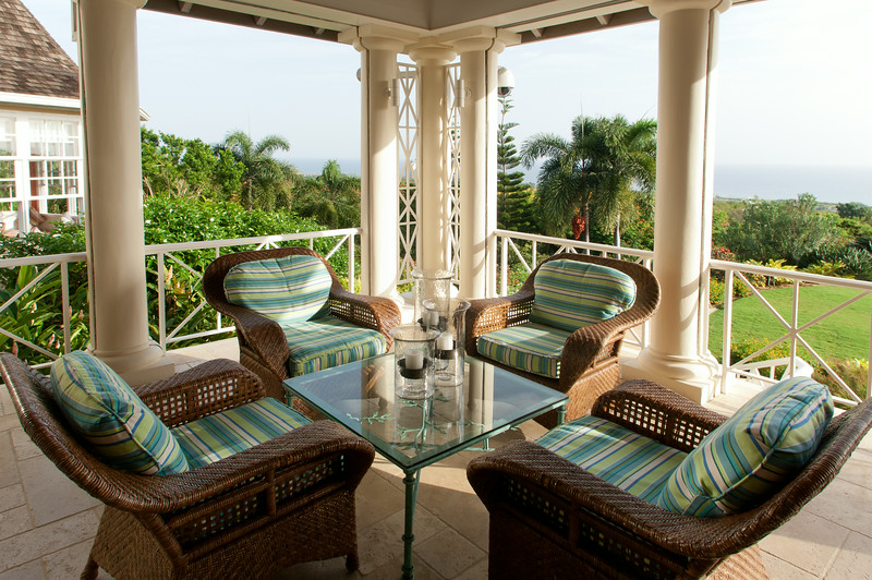 At the main house, the columned verandah is shaded and comfortable ...