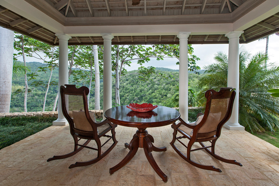 a custom-designed private balcony for two. To waken here is poetry as the morning sun touches the heavily-forested mountain across the valley. Eye-opener coffee is silently left by the butler
