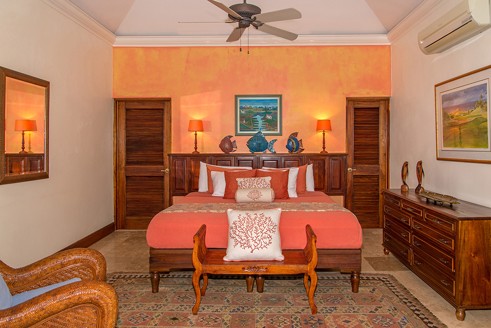 Bedroom 2 in tropical melon can be king- or twin-bedded and allows convenient proximity for parents and children occupying these two side-by-side bedrooms.