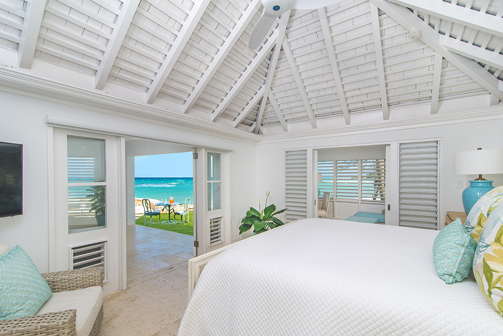 ACCOMMODATIONS
The MASTER SUITE under a peaked cedar ceiling opens to its own veranda ...