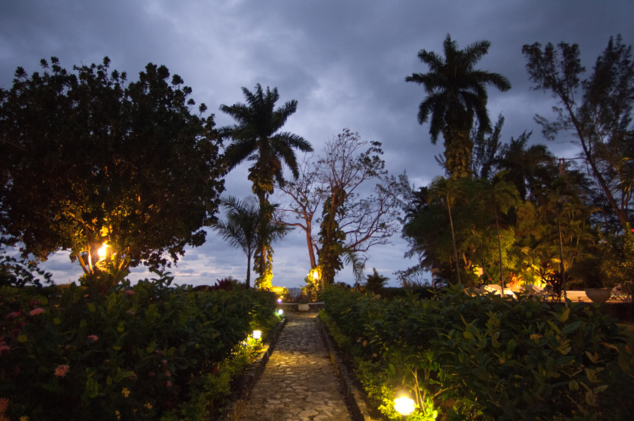 An old cut stone walkway leads through the lush garden to the beach, just a few yards from the villa.